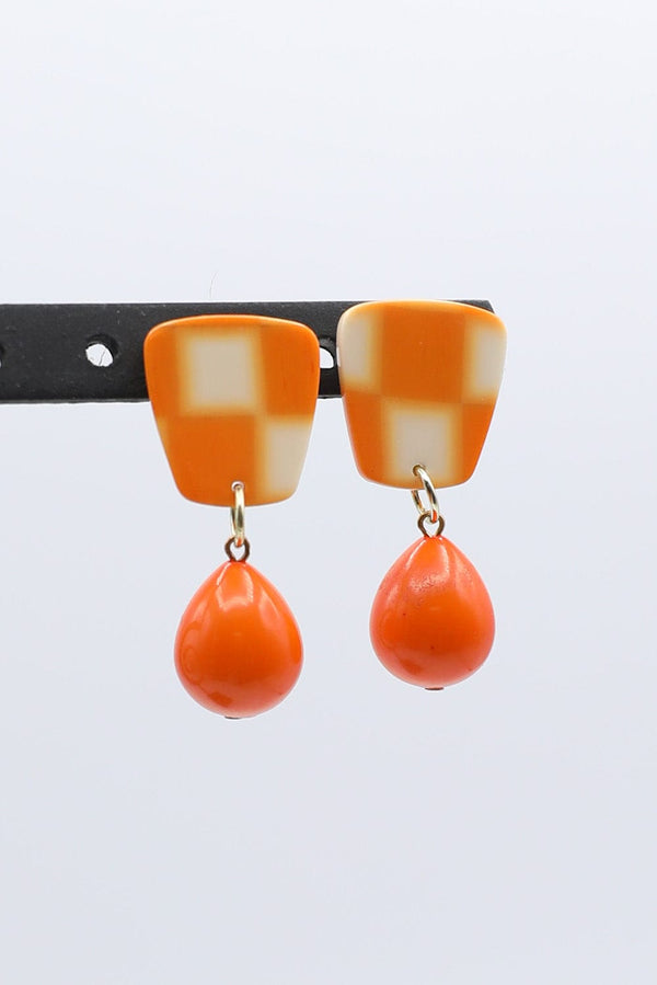 Checkerboard Earrings With Dangling Solid Orange Teardrop Accent Bead
