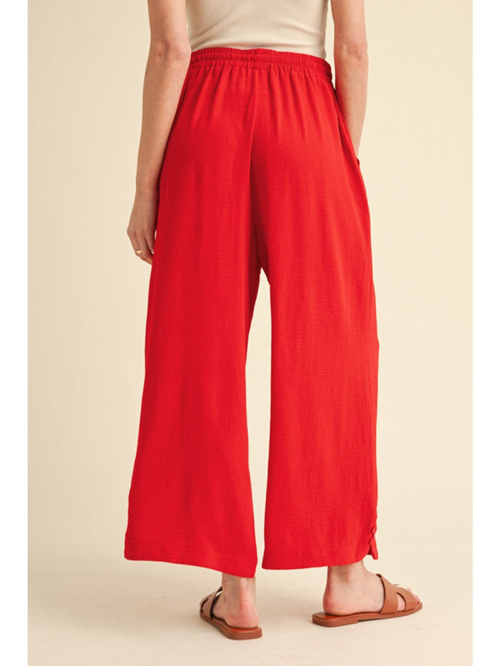 Jodifl Flowy Lightweight Loose Fit Drawstring Waist Pants with Button Detailing at Hem