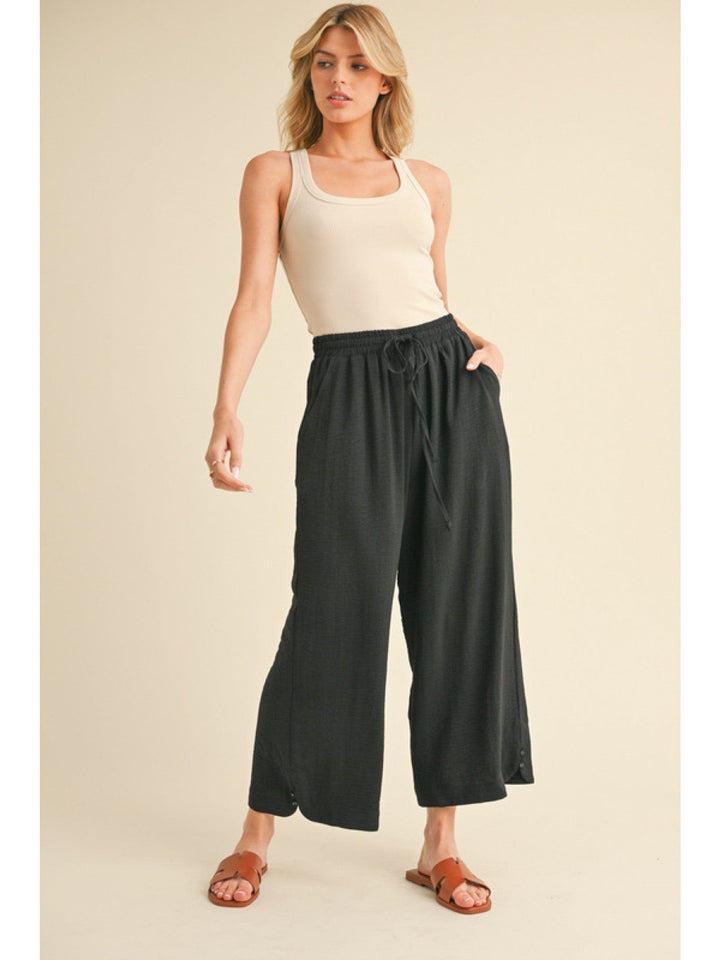 Jodifl Flowy Lightweight Loose Fit Drawstring Waist Pants with Button Detailing at Hem