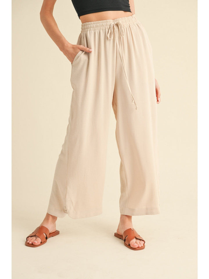 Jodifl Flowy Lightweight Loose Fit Drawstring Waist Pants with Button Detailing at Hem