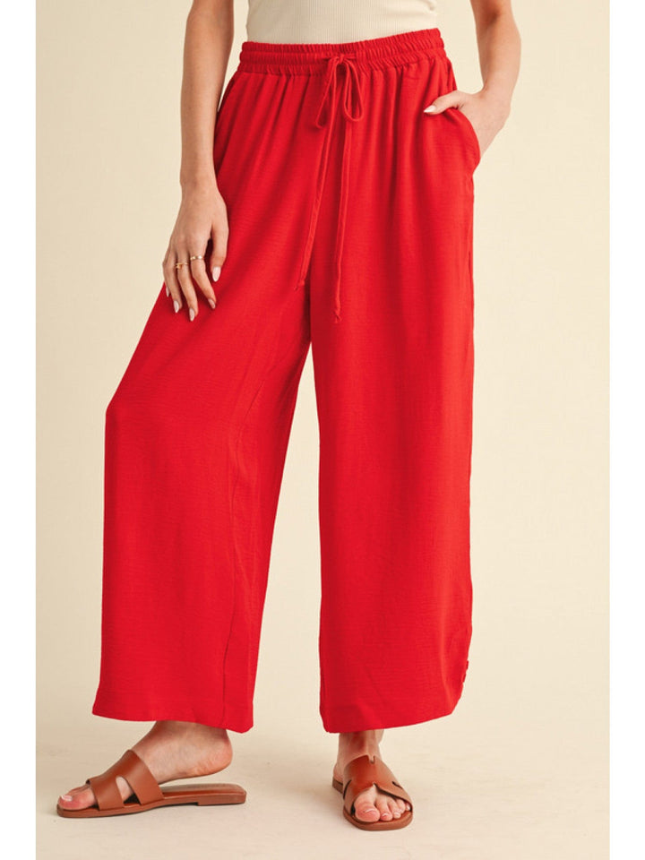 Jodifl Flowy Lightweight Loose Fit Drawstring Waist Pants with Button Detailing at Hem