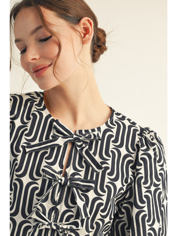 Jodifl Geometric Pattern Front Tie Peplum Top
