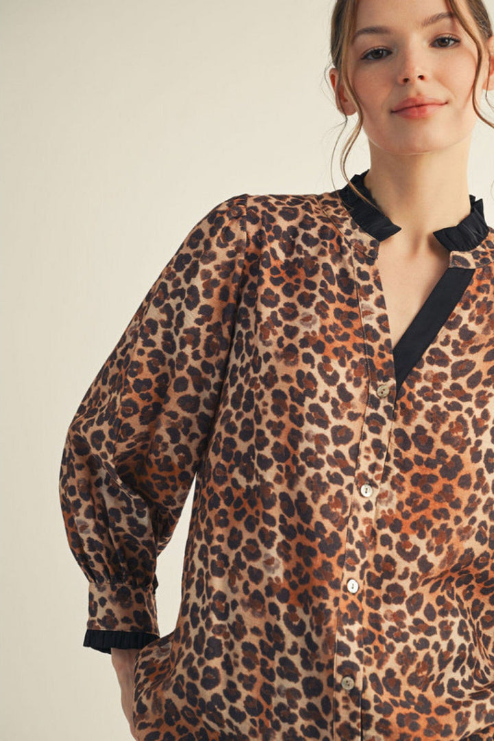Jodifl Long Sleeve Contrast Color Accented Animal Print Split Neckline Top