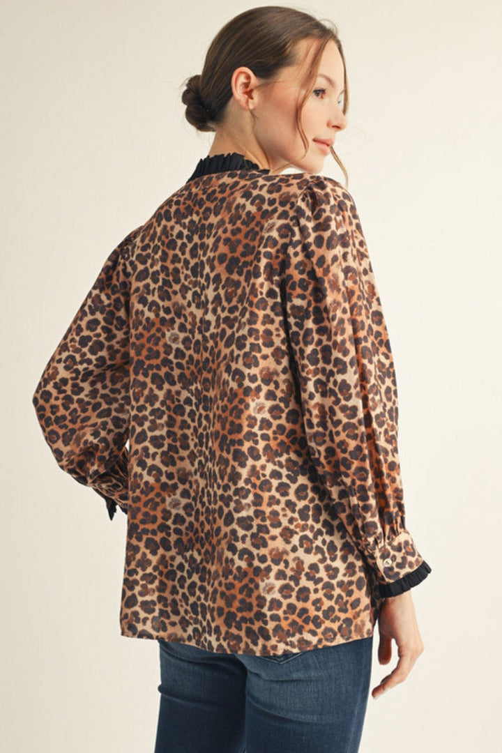 Jodifl Long Sleeve Contrast Color Accented Animal Print Split Neckline Top