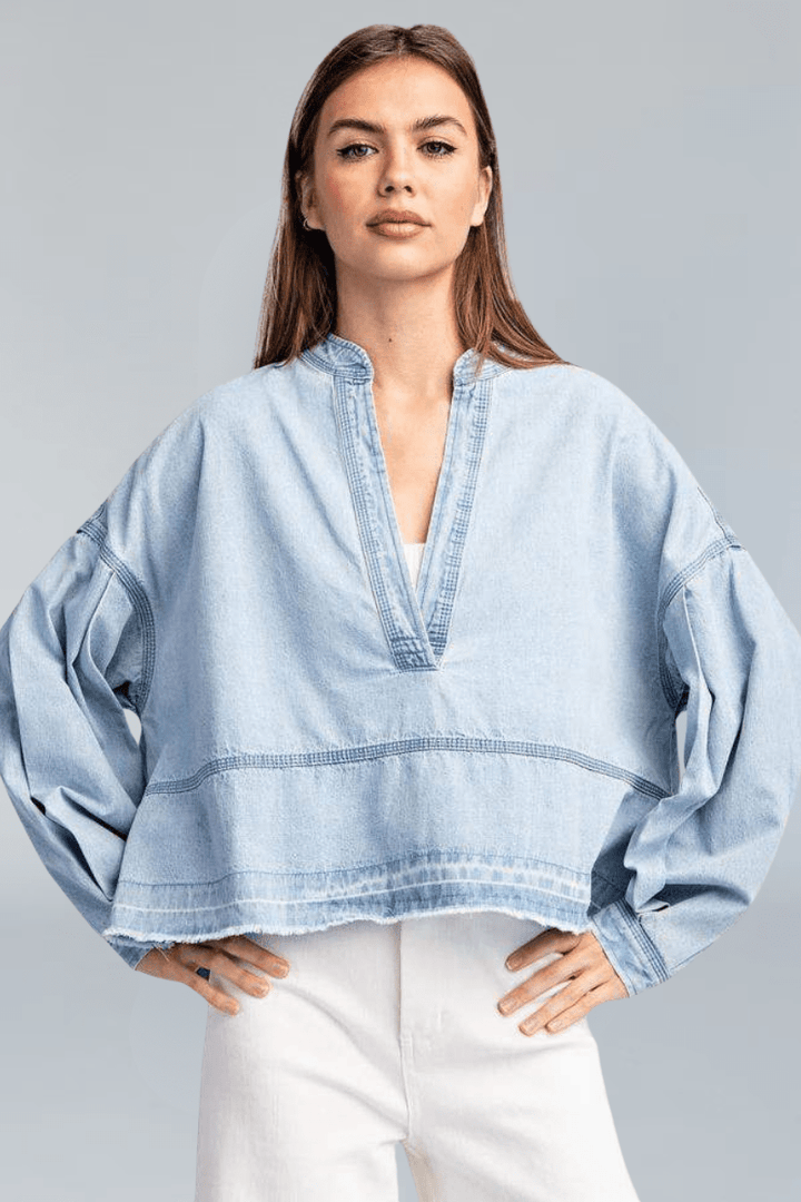 Light Wash Deep V-Neck Collared Denim Top with Exposed Stitching and Raw Hem Detailing