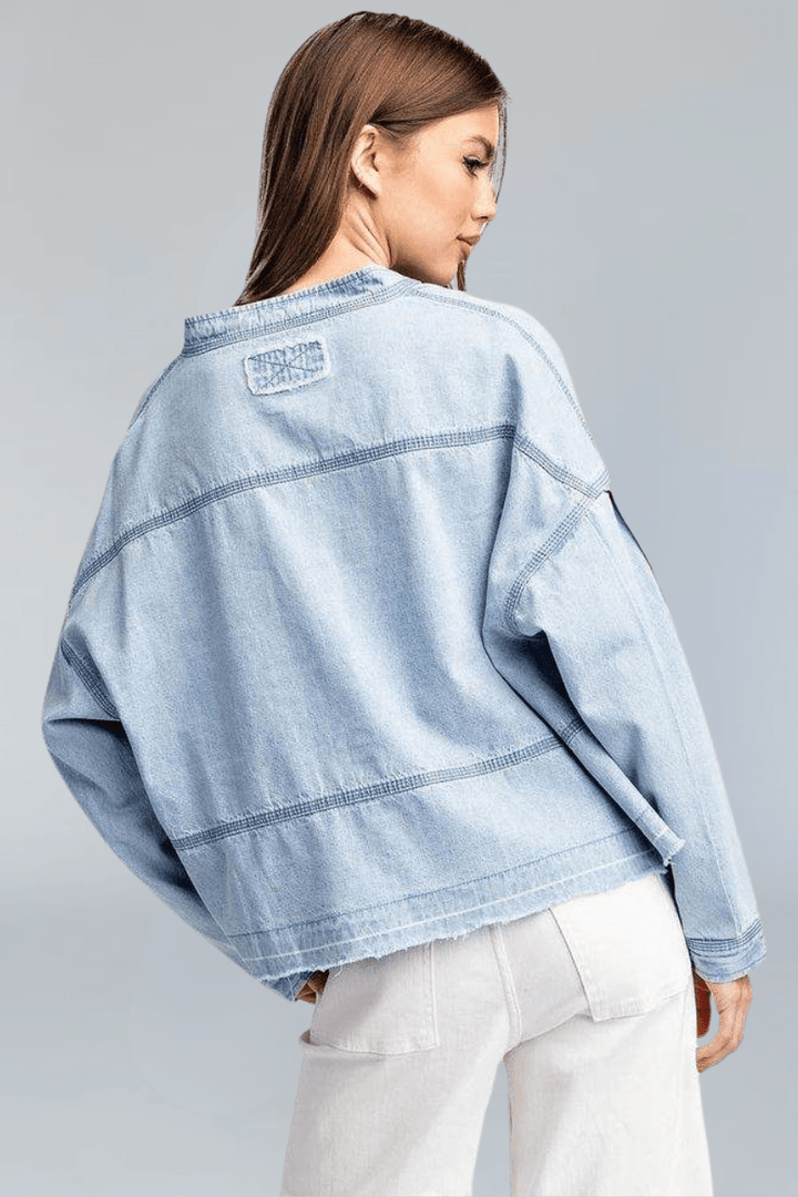 Light Wash Deep V-Neck Collared Denim Top with Exposed Stitching and Raw Hem Detailing