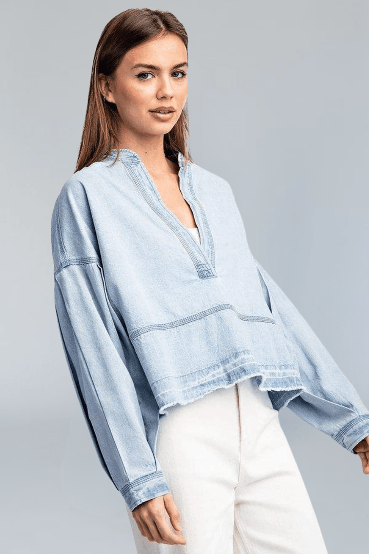 Light Wash Deep V-Neck Collared Denim Top with Exposed Stitching and Raw Hem Detailing