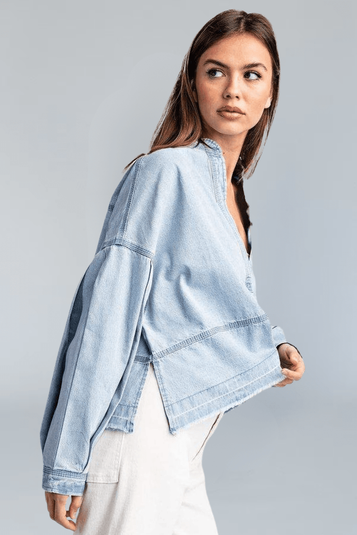 Light Wash Deep V-Neck Collared Denim Top with Exposed Stitching and Raw Hem Detailing