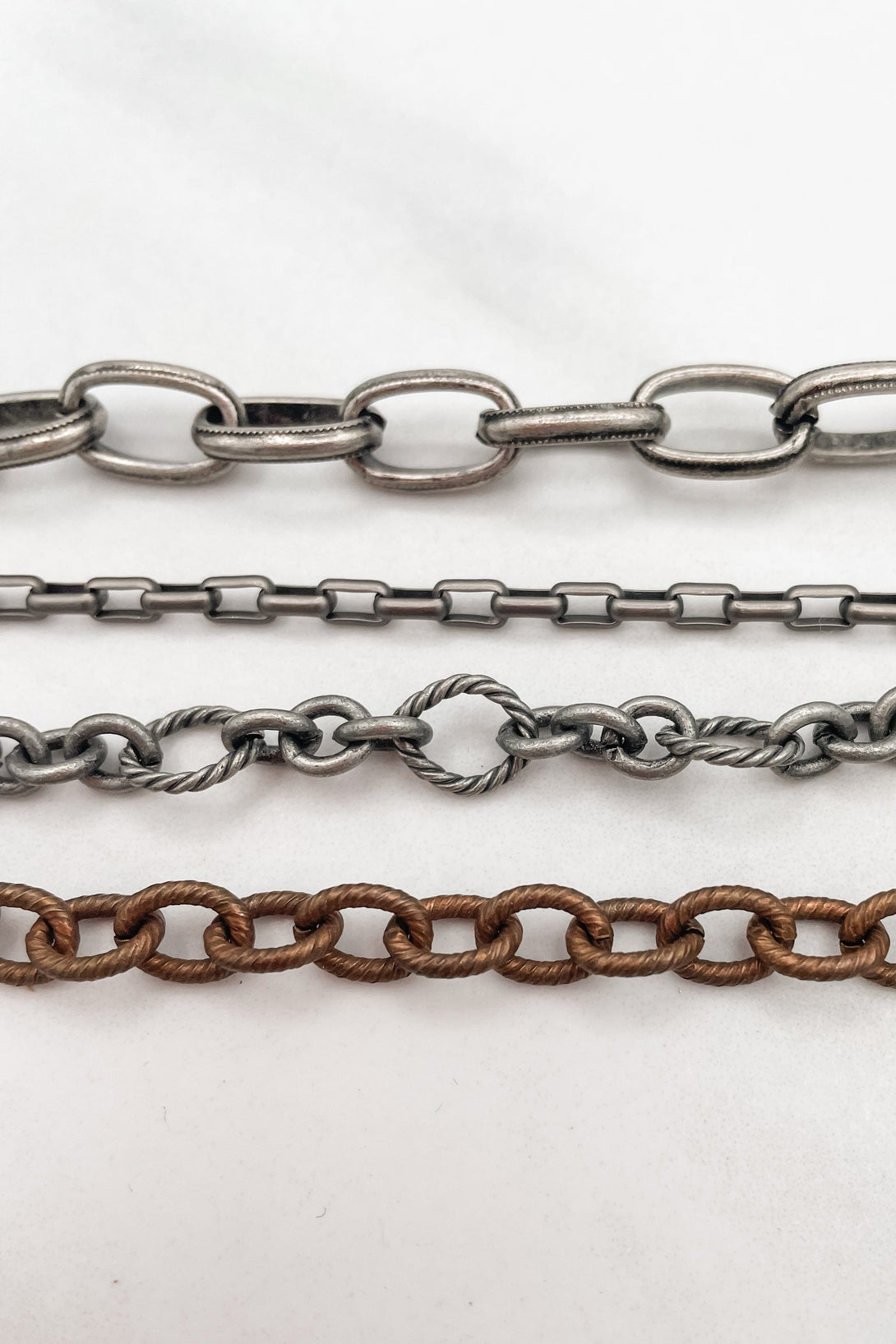 Multi Metal 4 Strand Chain Bracelet with Cross Dangle