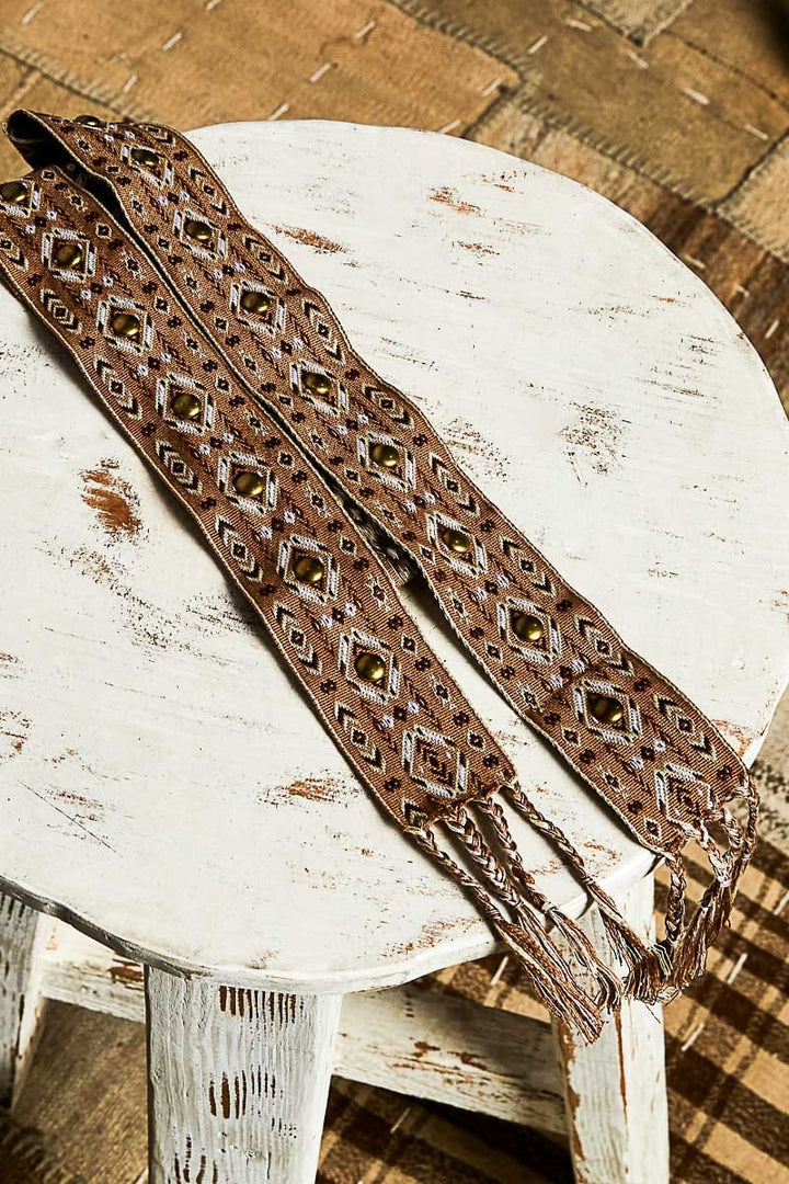 POL Detailed Tribal Pattern Fabric Tie Belt with Stud Accents and Braided Tassel Ends