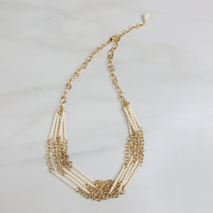 Cascade Five Strand Necklace with Ivory Swirl Beads and Gold Plated Chain