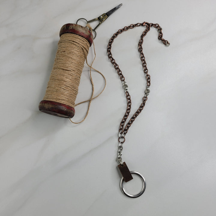 Handmade Necklace with Bronze Plated Etched Cable Chain, Drop Feature, Leather, and Silver Ring Pendant