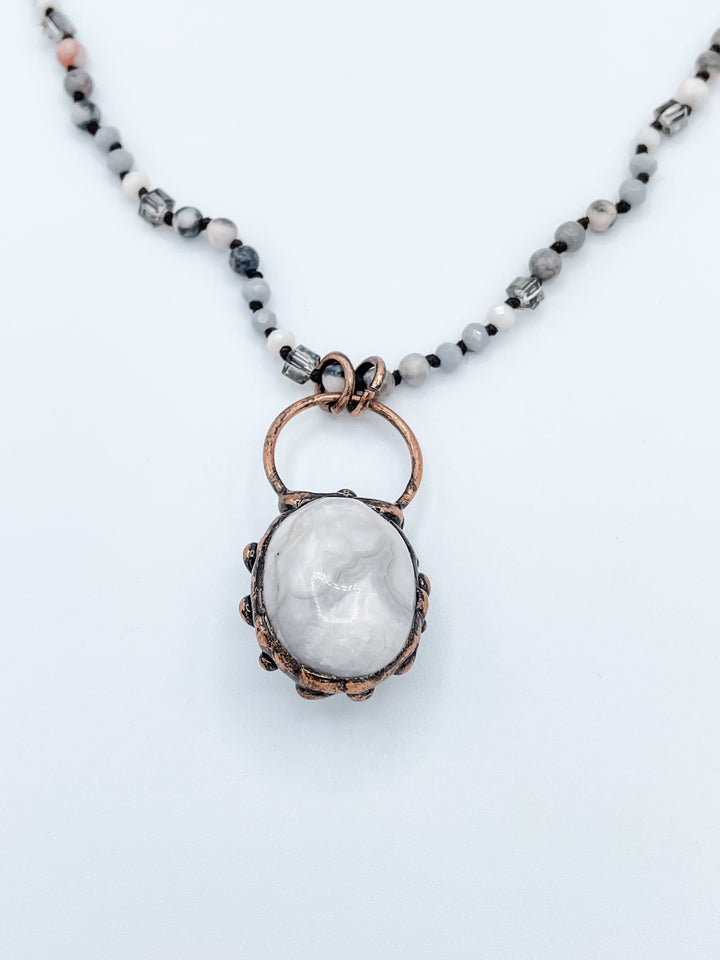 Large Grey Stone Pendant on Multi Colored Beaded Necklace
