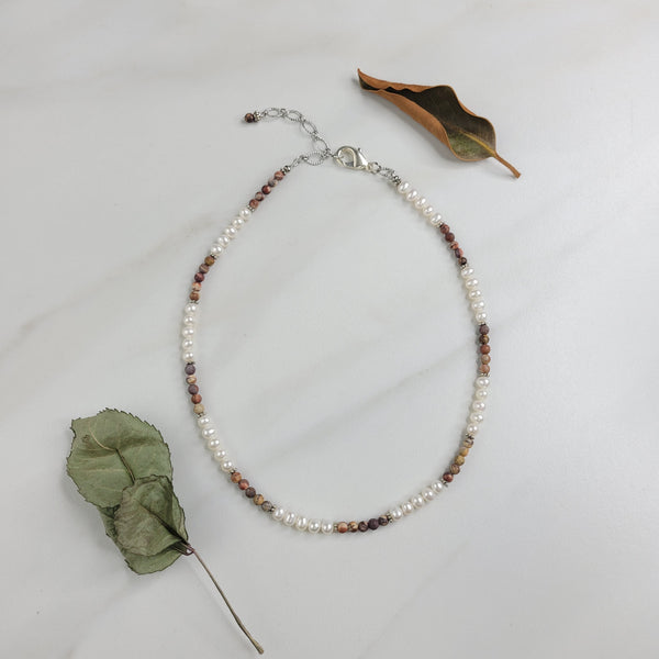 Handmade Necklace with rhyolite beads, freshwater pearls, and silver plated cable chain